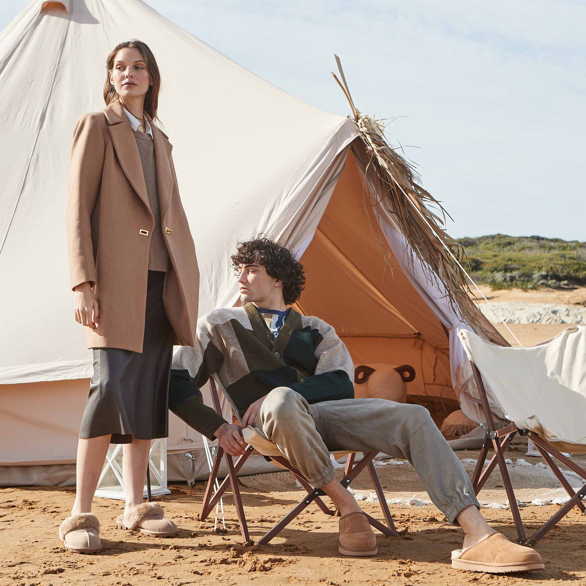 couple on their camping trip looking cosy and fashionable with their matching UGG slippers