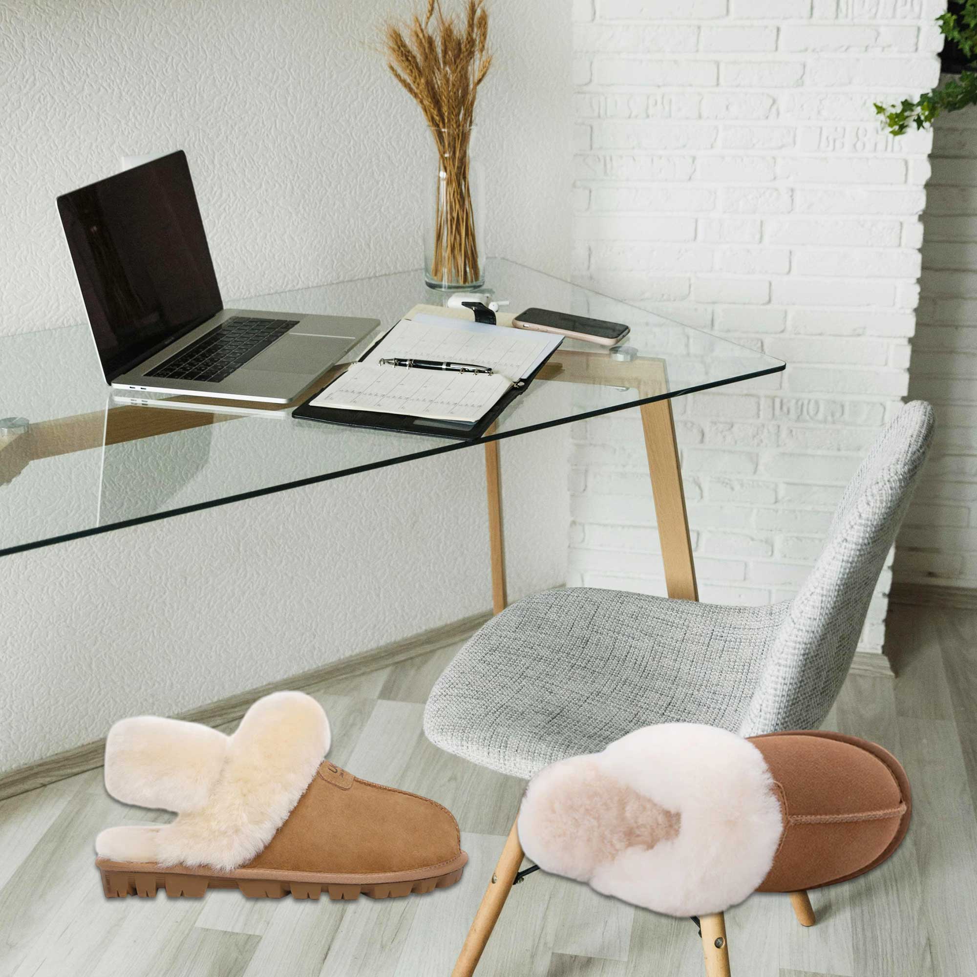 desk setup with UGG slippers on display