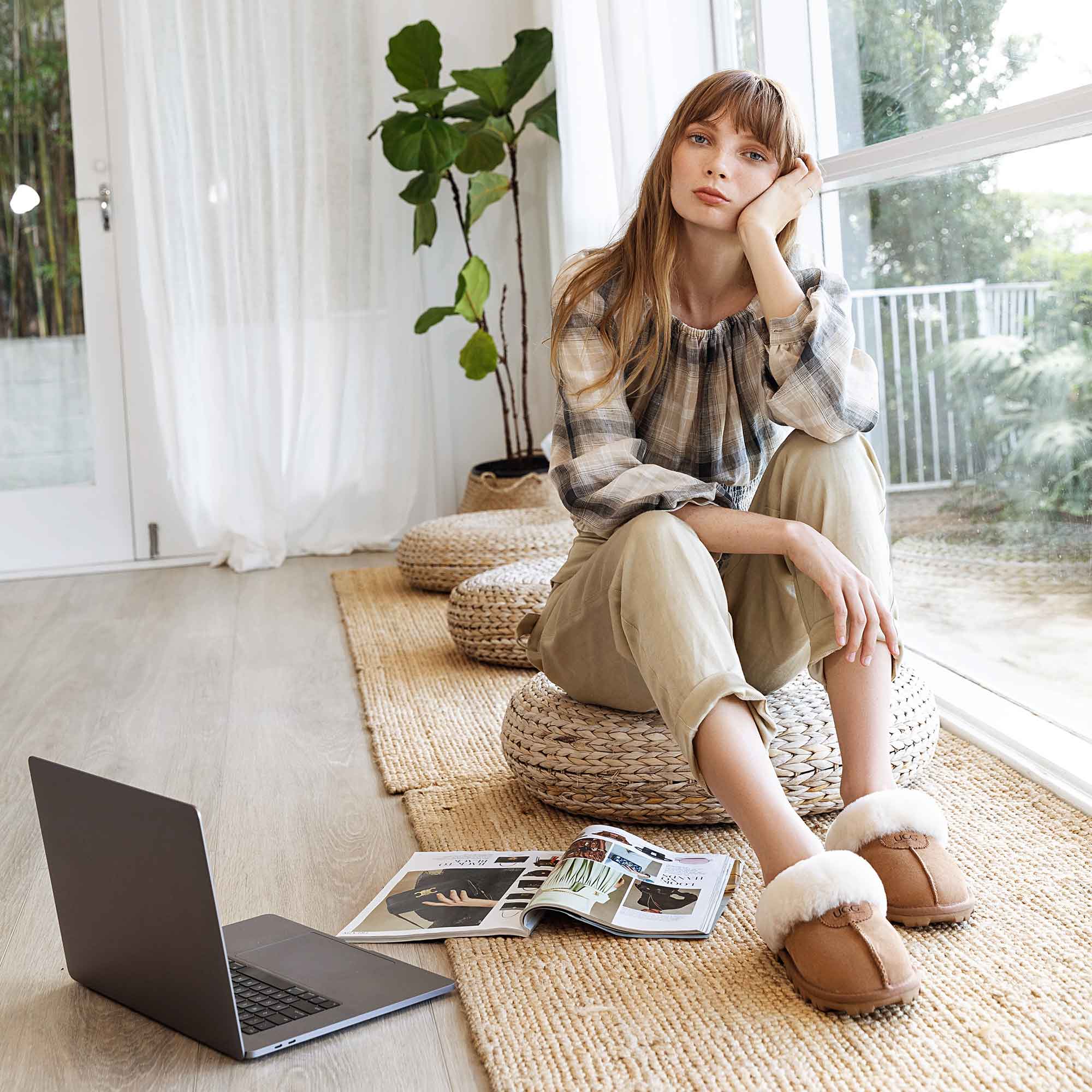 house wife relaxing at home while wearing UGG slippers