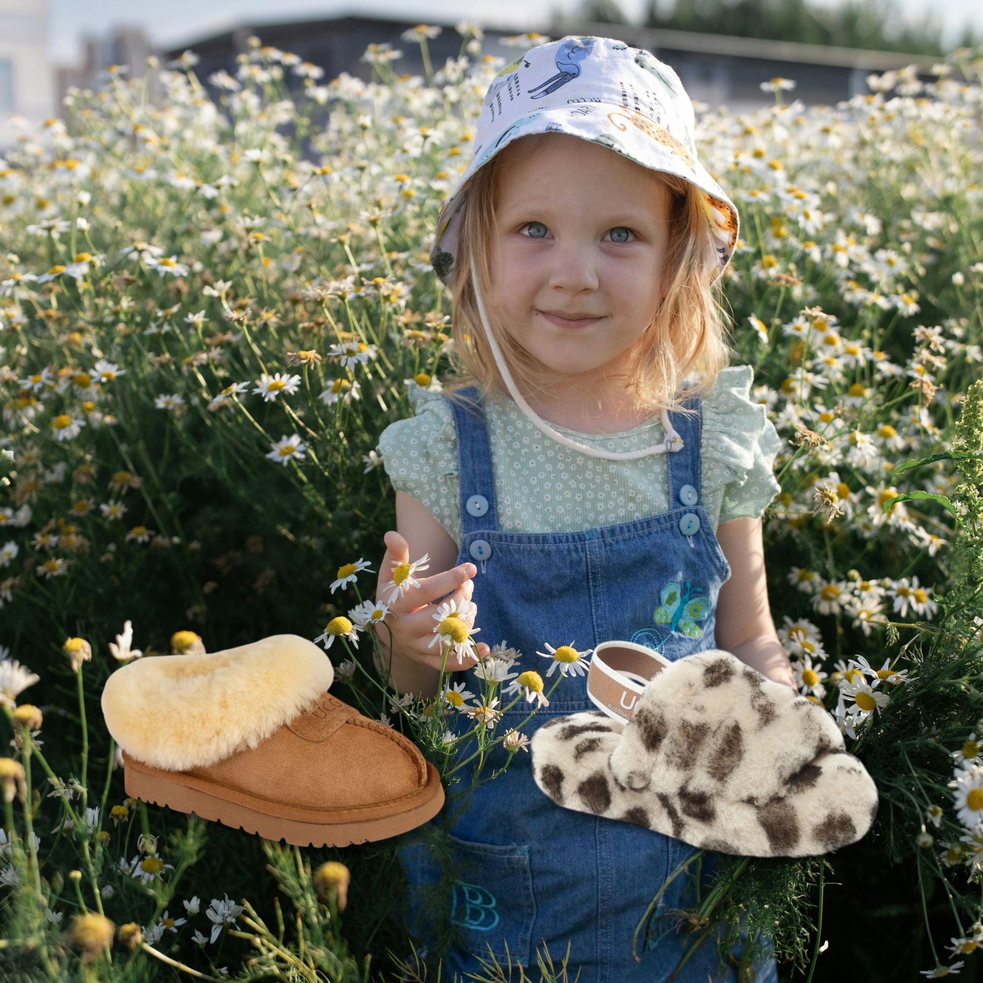 little girl enjoying outdoors with kids UGG slippers
