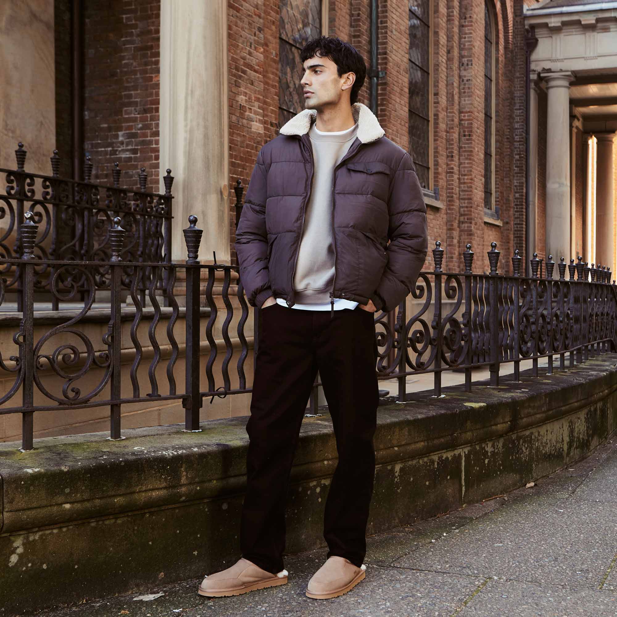 man wearing casual wear paired with UGG slippers for the days errand