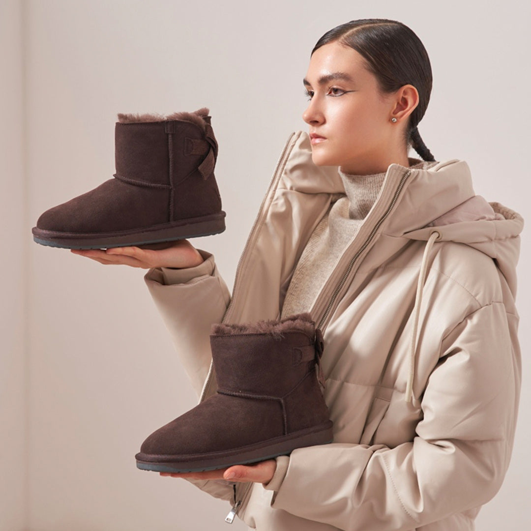 Melbourne Fashionista Holding UGG Boots