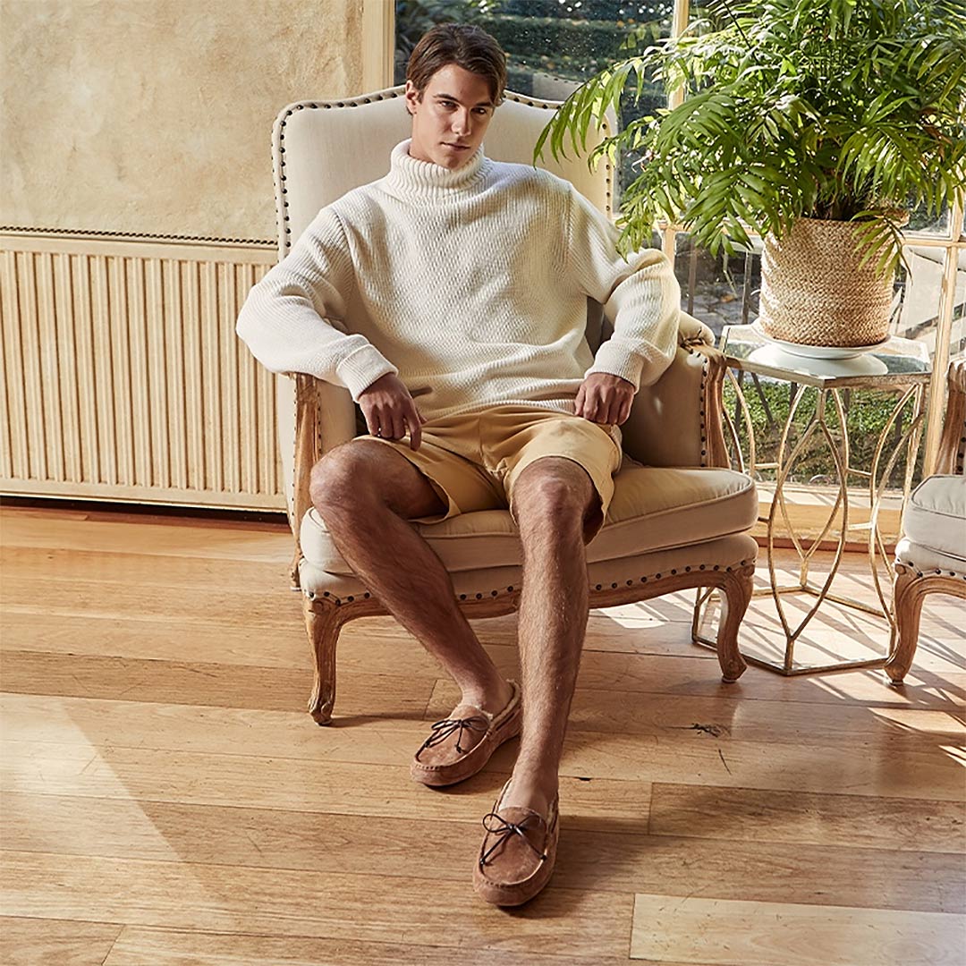 Man Wearing UGG Moccasin Slippers