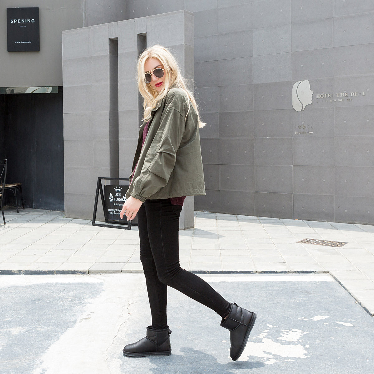 a girl walking outside wearing ugg boots