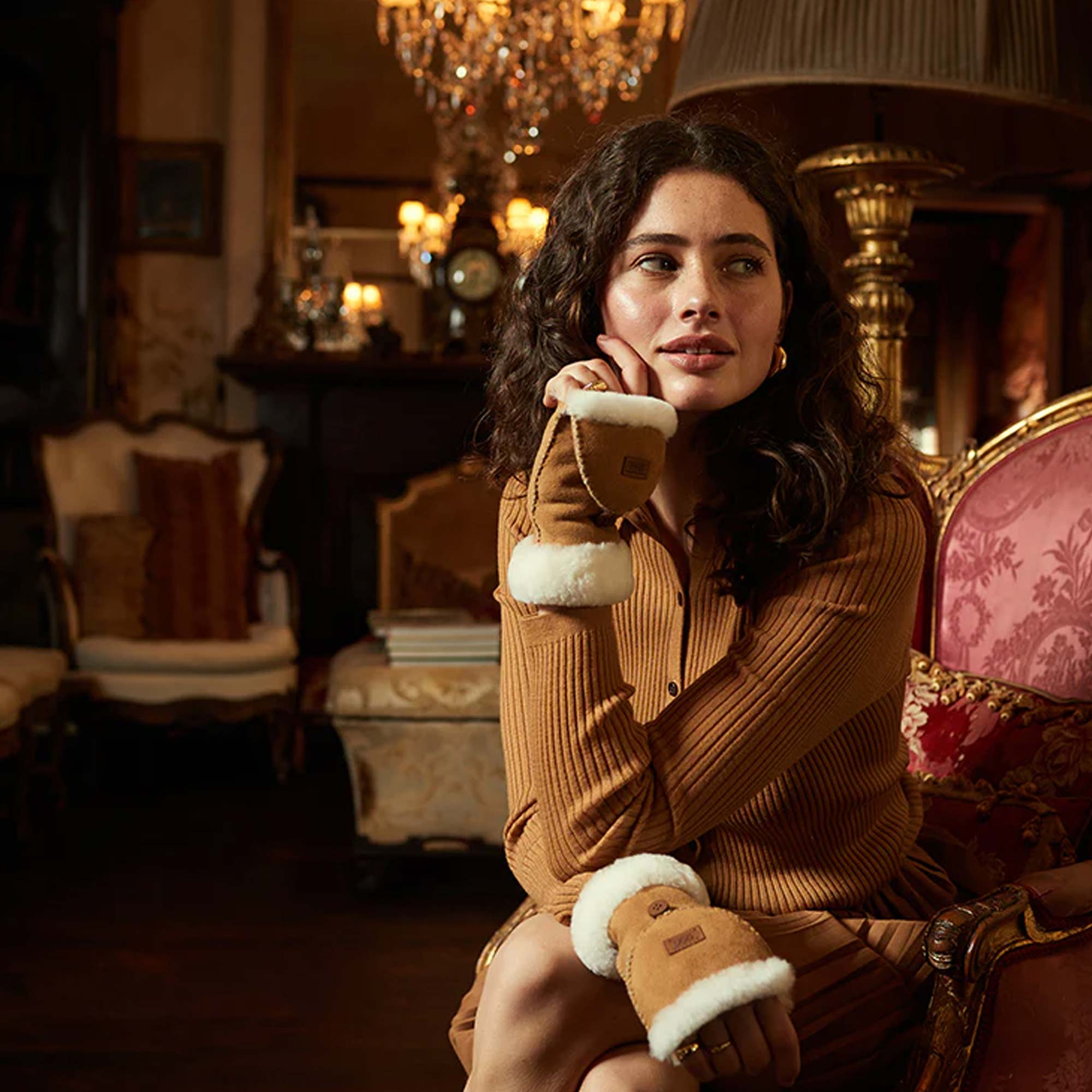 woman attending an event with her matching outfit and UGG Sheepskin-mittens