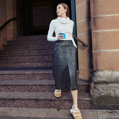 woman-grabbing-a-coffee-while-strolling-around-sydney-and-wearing-ugg-fluffs