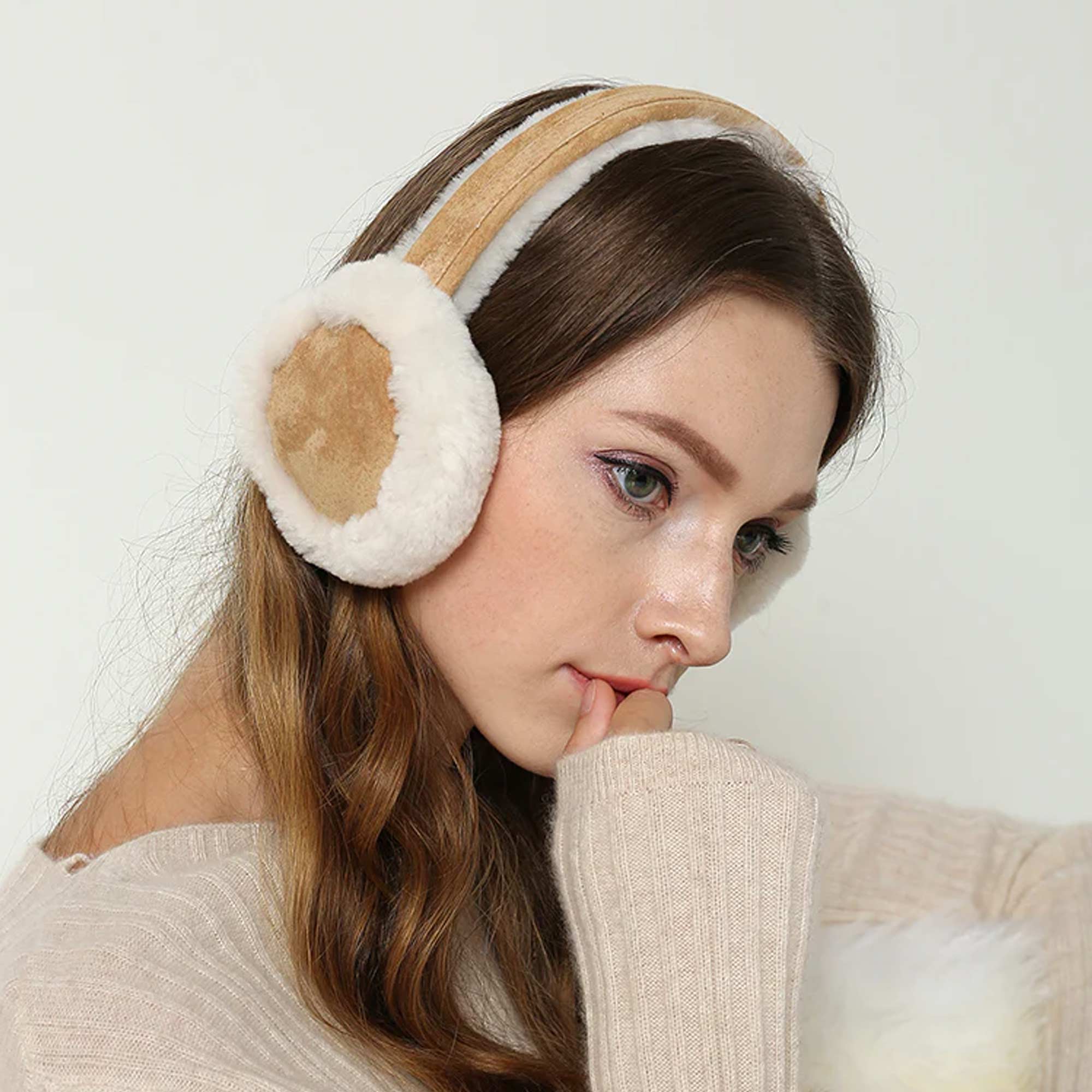 woman looking cosy on winter while wearing UGG Earmuffs