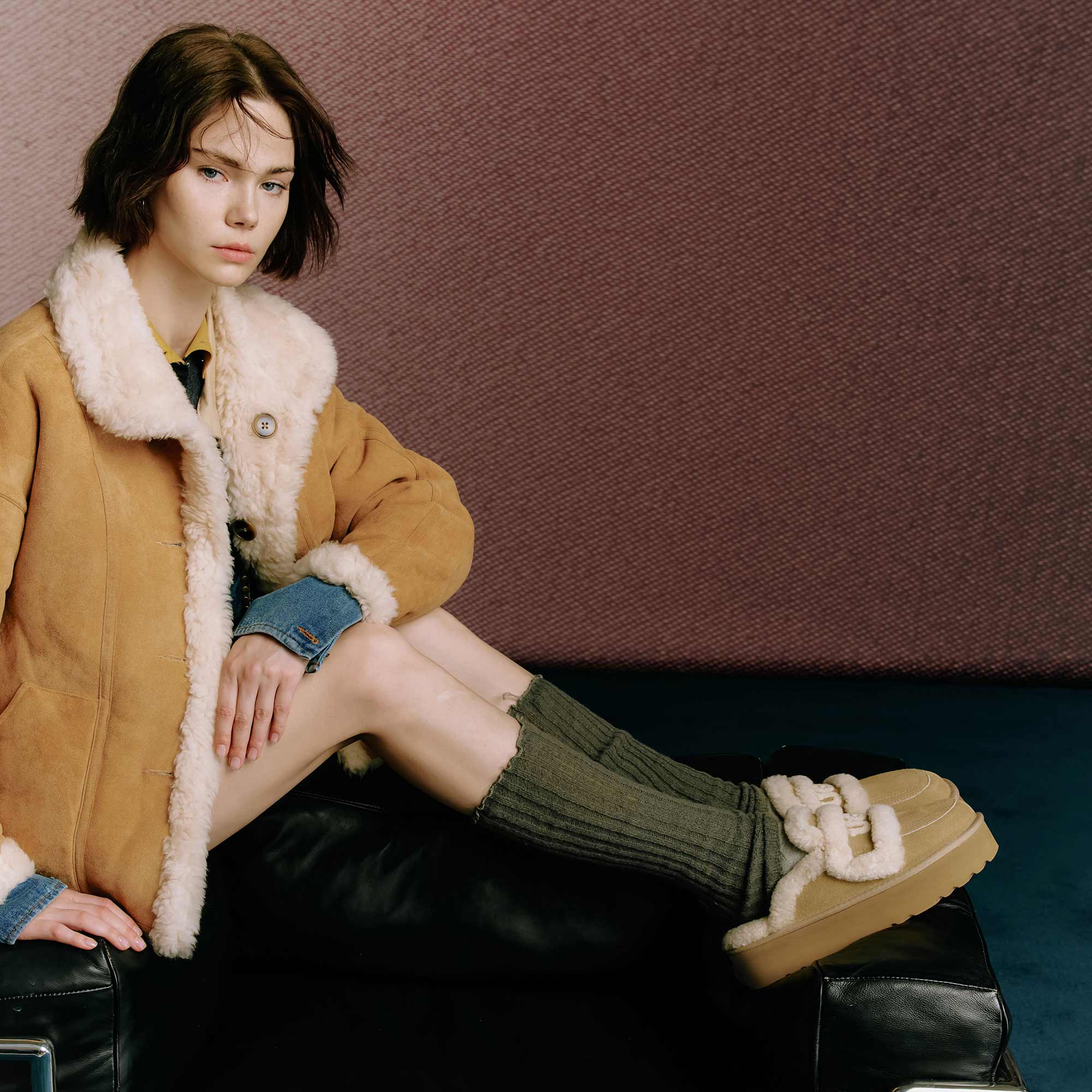 Woman looking cosy with her winter pop outfit with UGG slippers