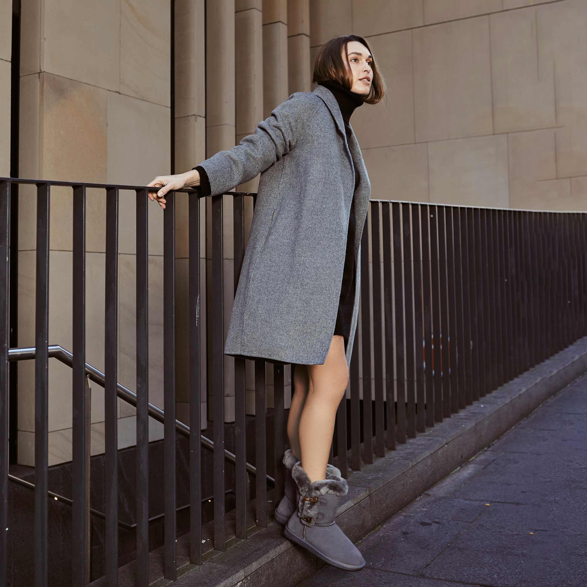 woman looking fashionable on her oversized blazers and UGG boots
