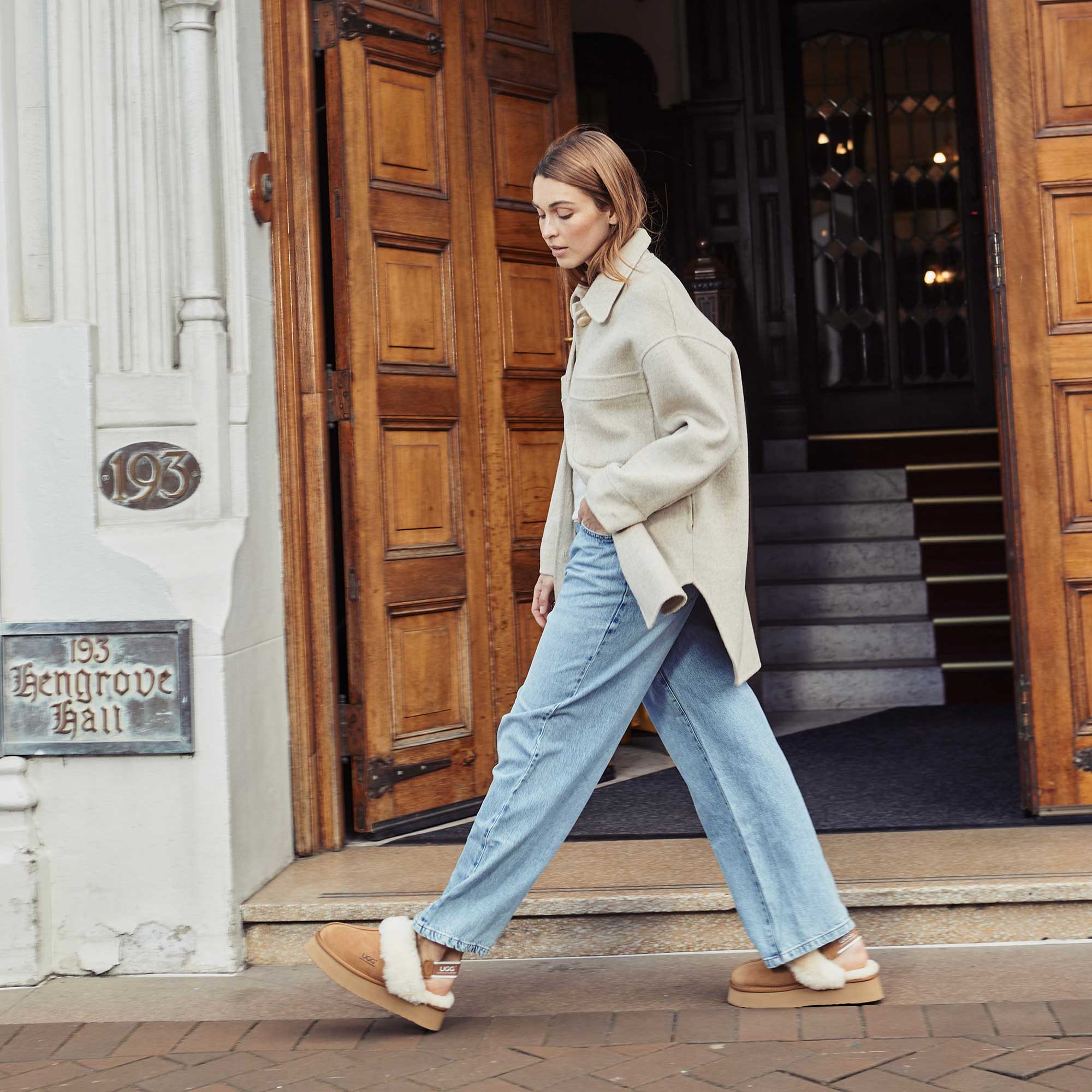 woman walking outside with her Australia made UGG slippers