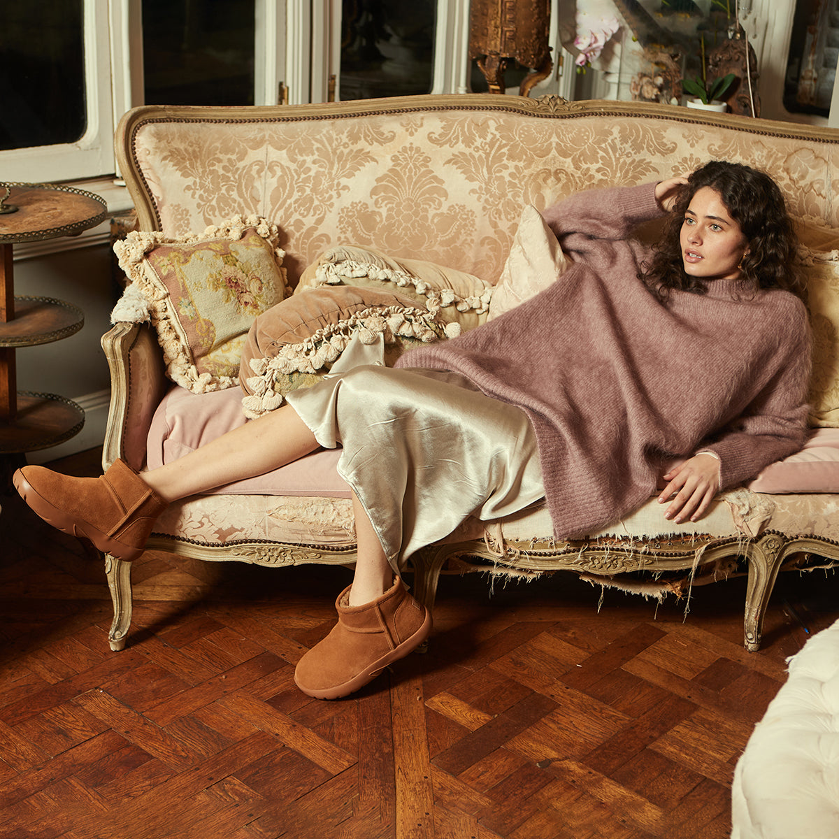 woman wearing oversized knits with UGG boots for spring