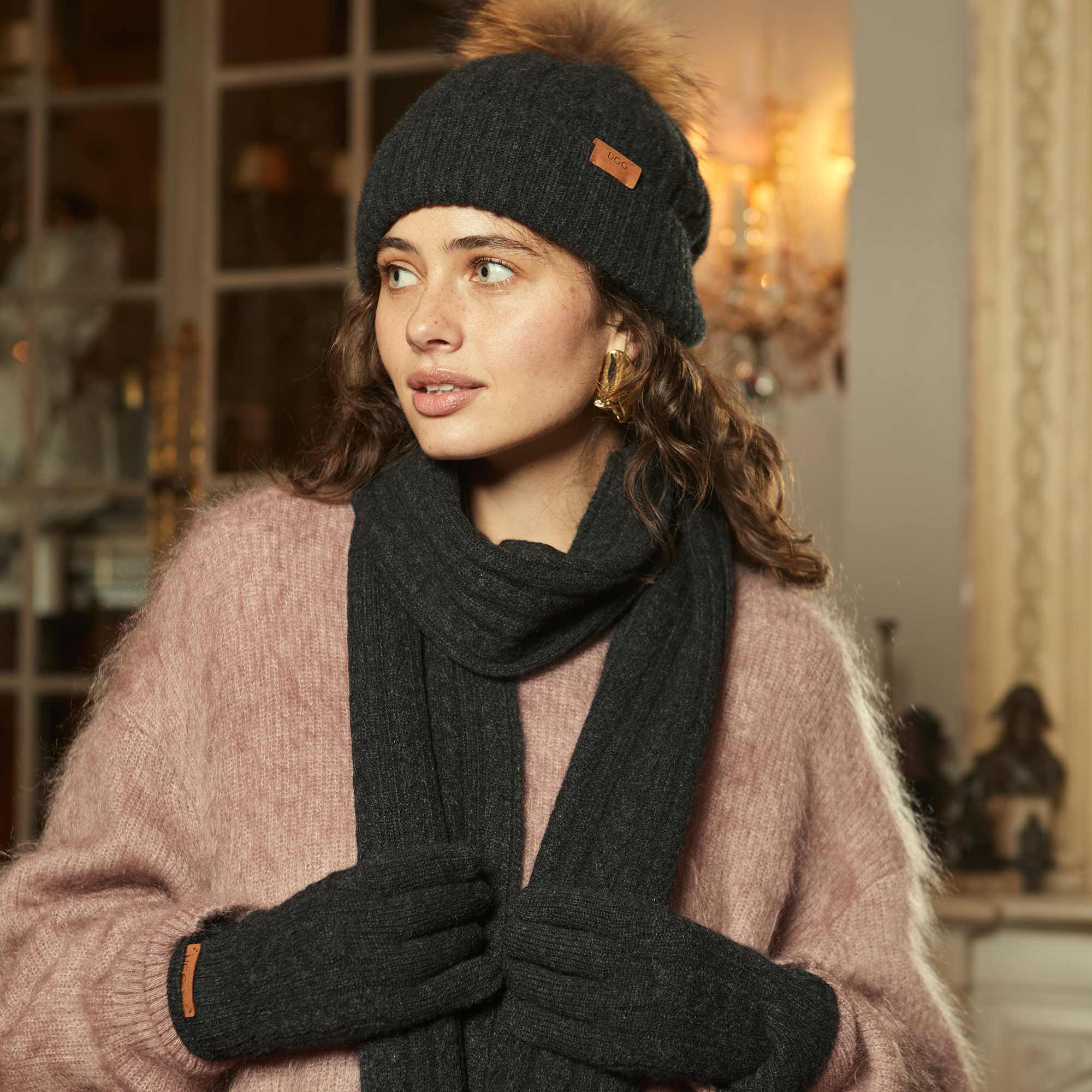 woman wearing sustainable knit wear paired with other UGG Accessories