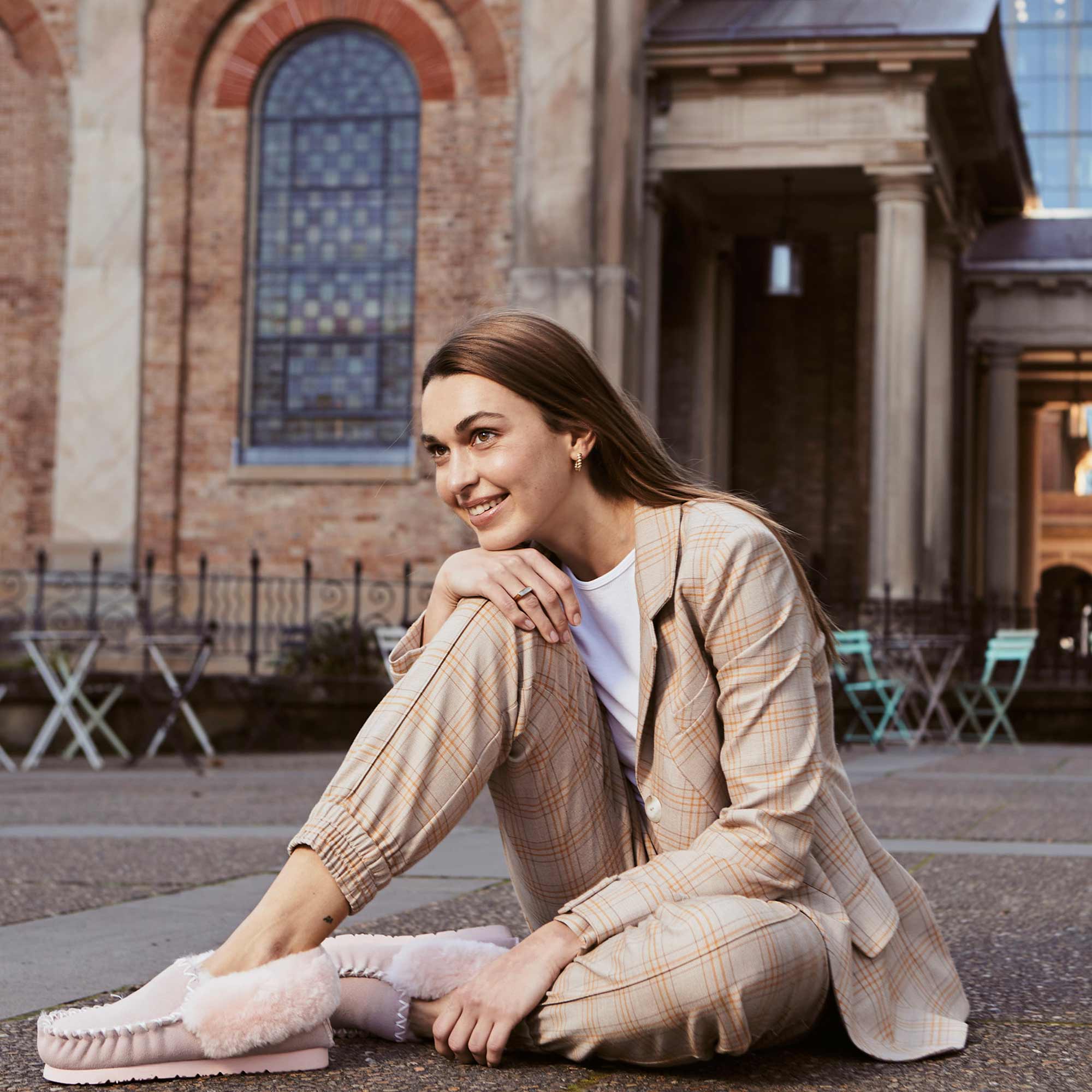 woman-wearing-work-wear-and-ugg-moccasins-she-received-as-women-gift-set