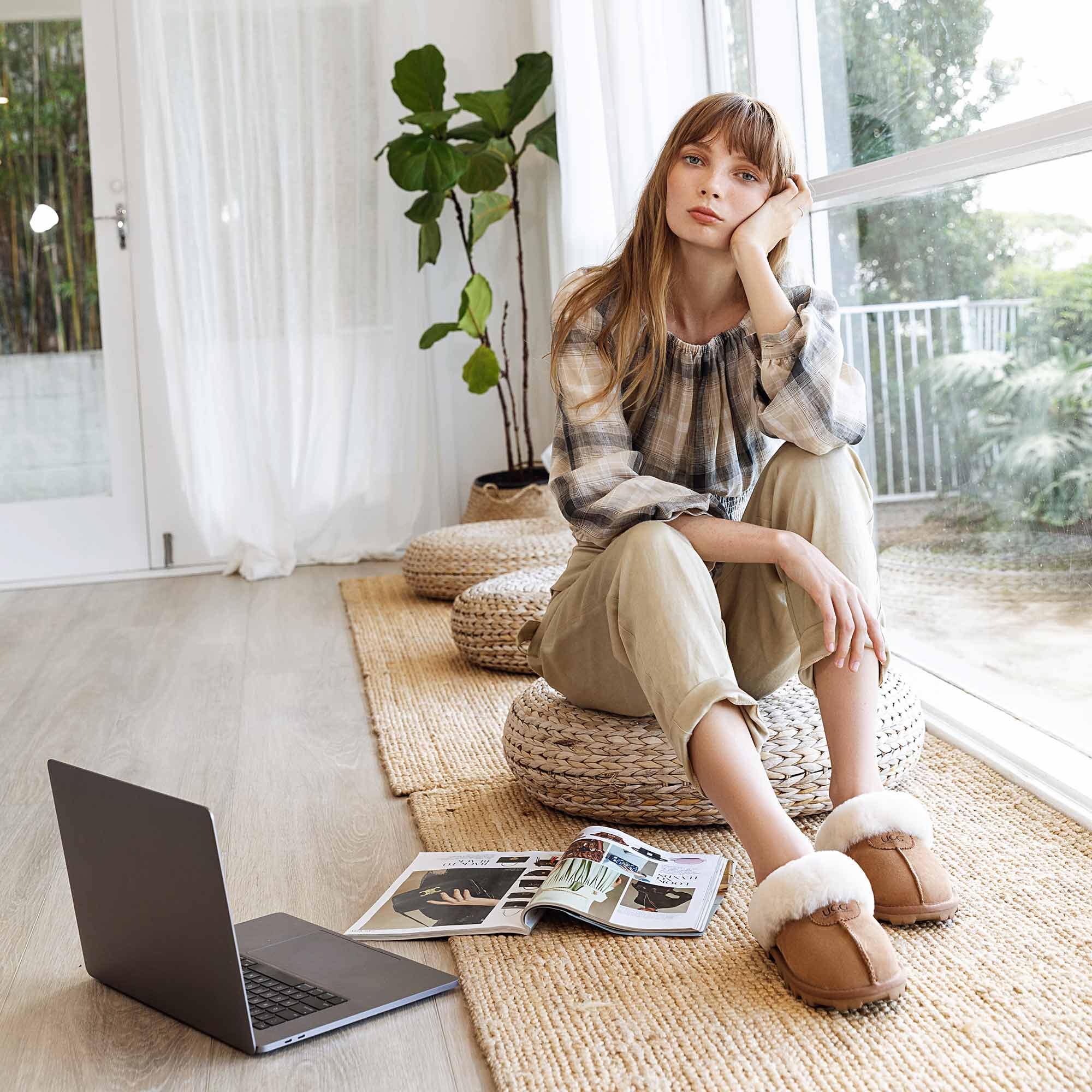 woman working from home with indoor UGG slippers