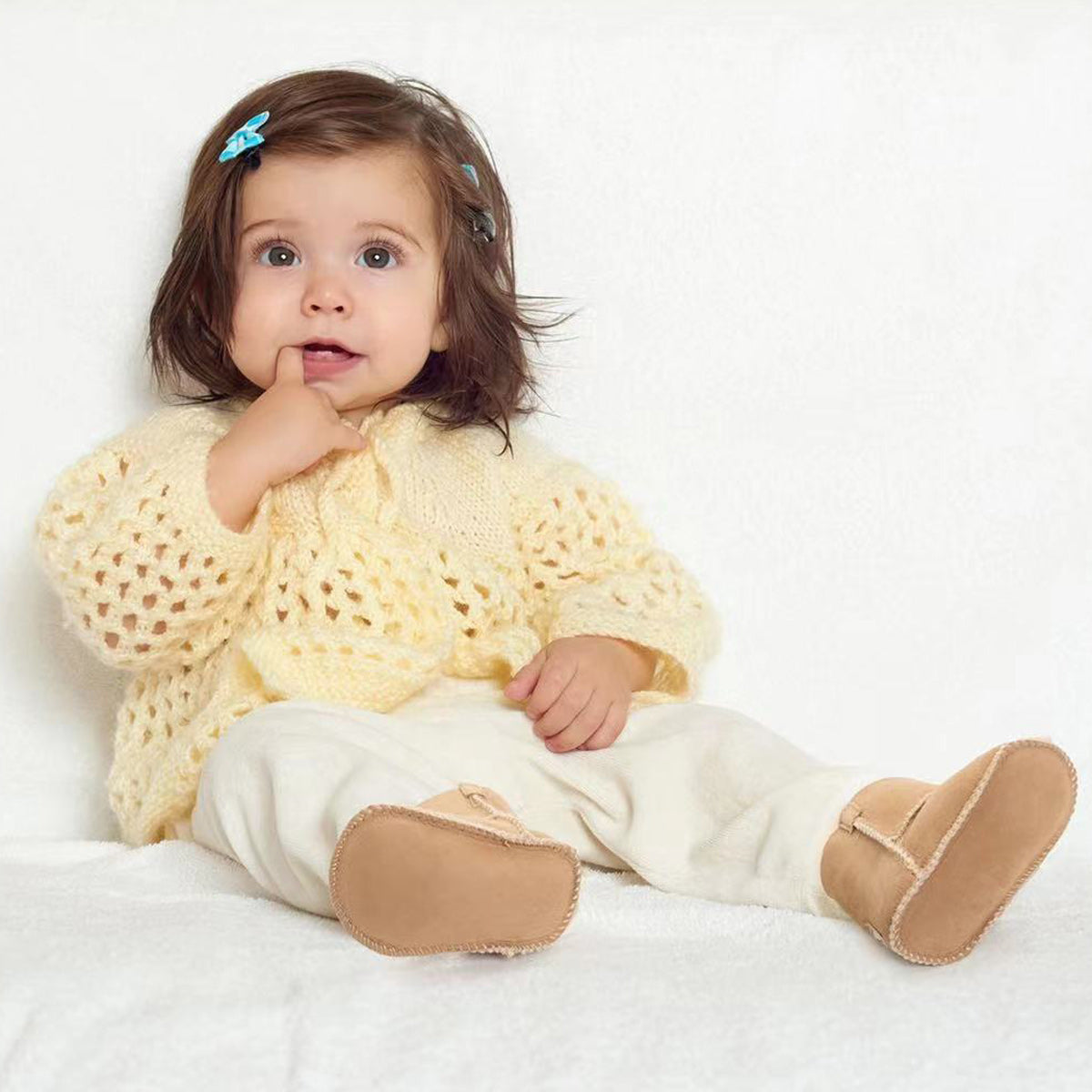 baby looking stylish and cosy with UGG boots