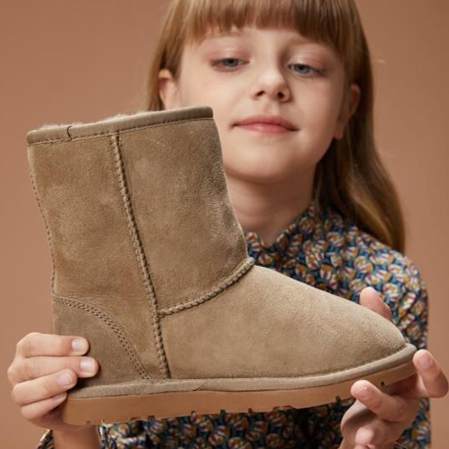 Australian Girl Model Holding a UGG Boot