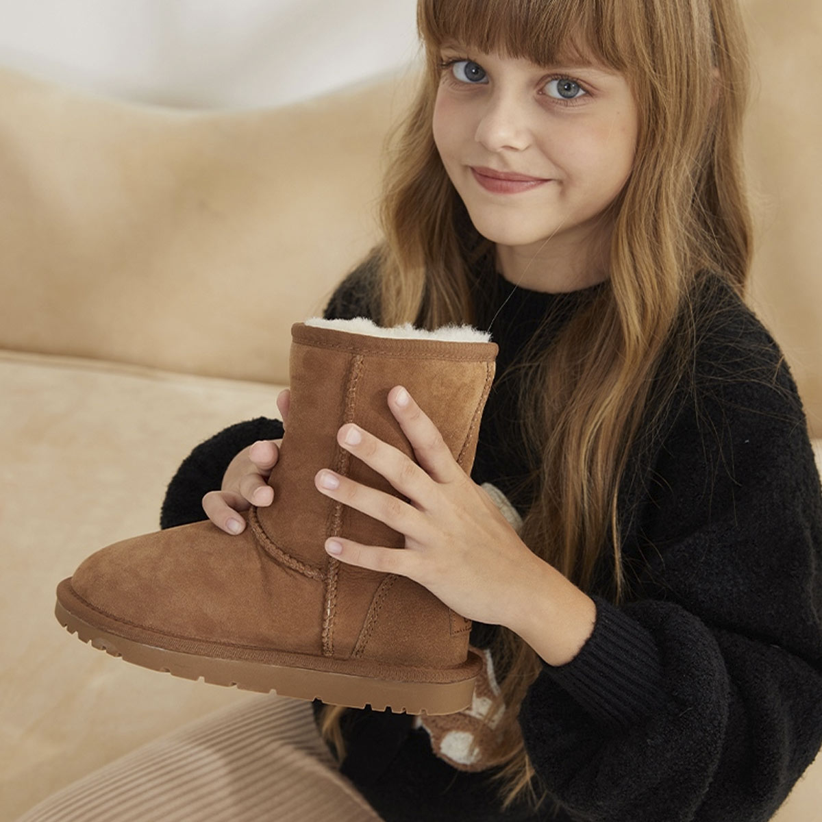 Girl Holding UGG Boots