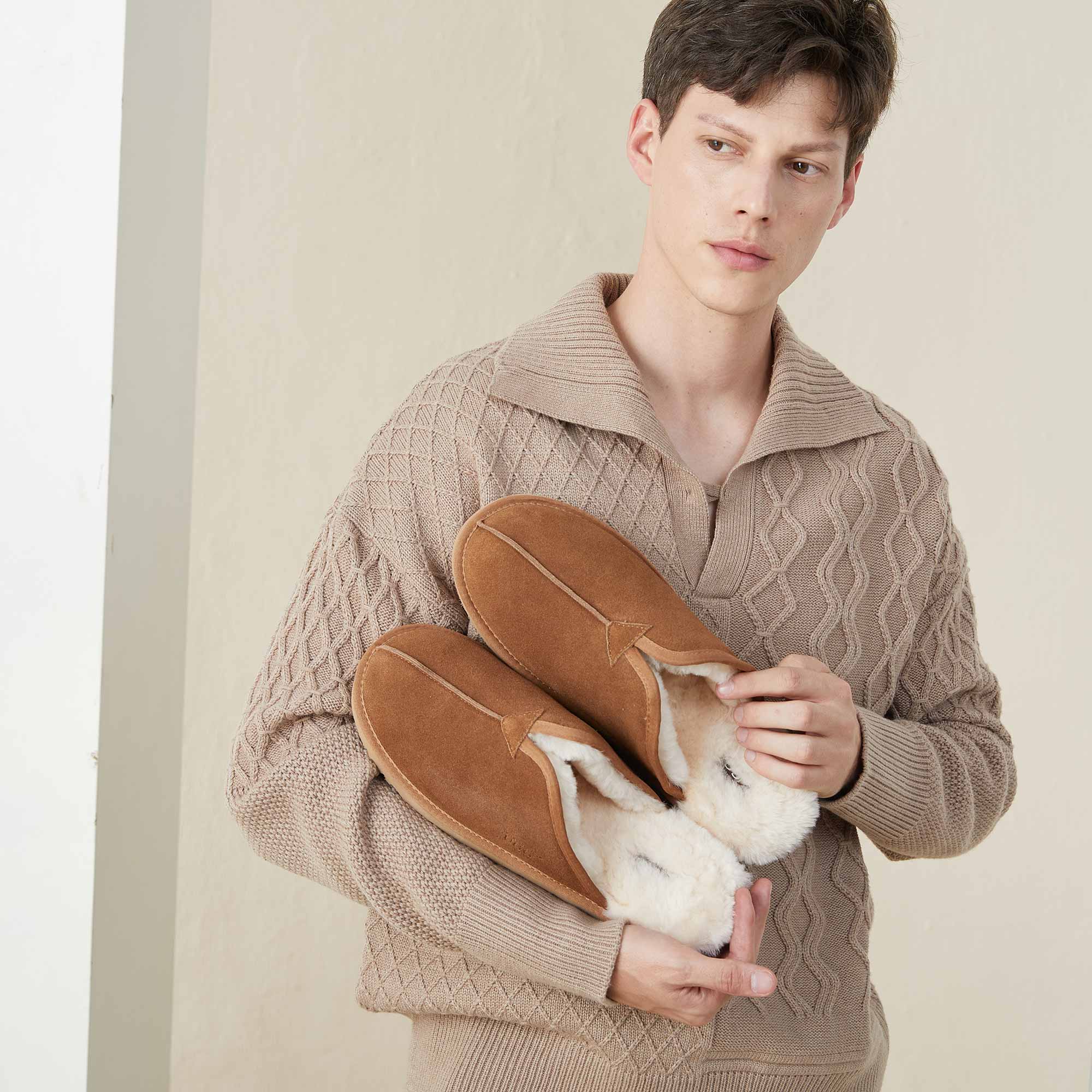 man ready to feel cosy at home with UGG slippers