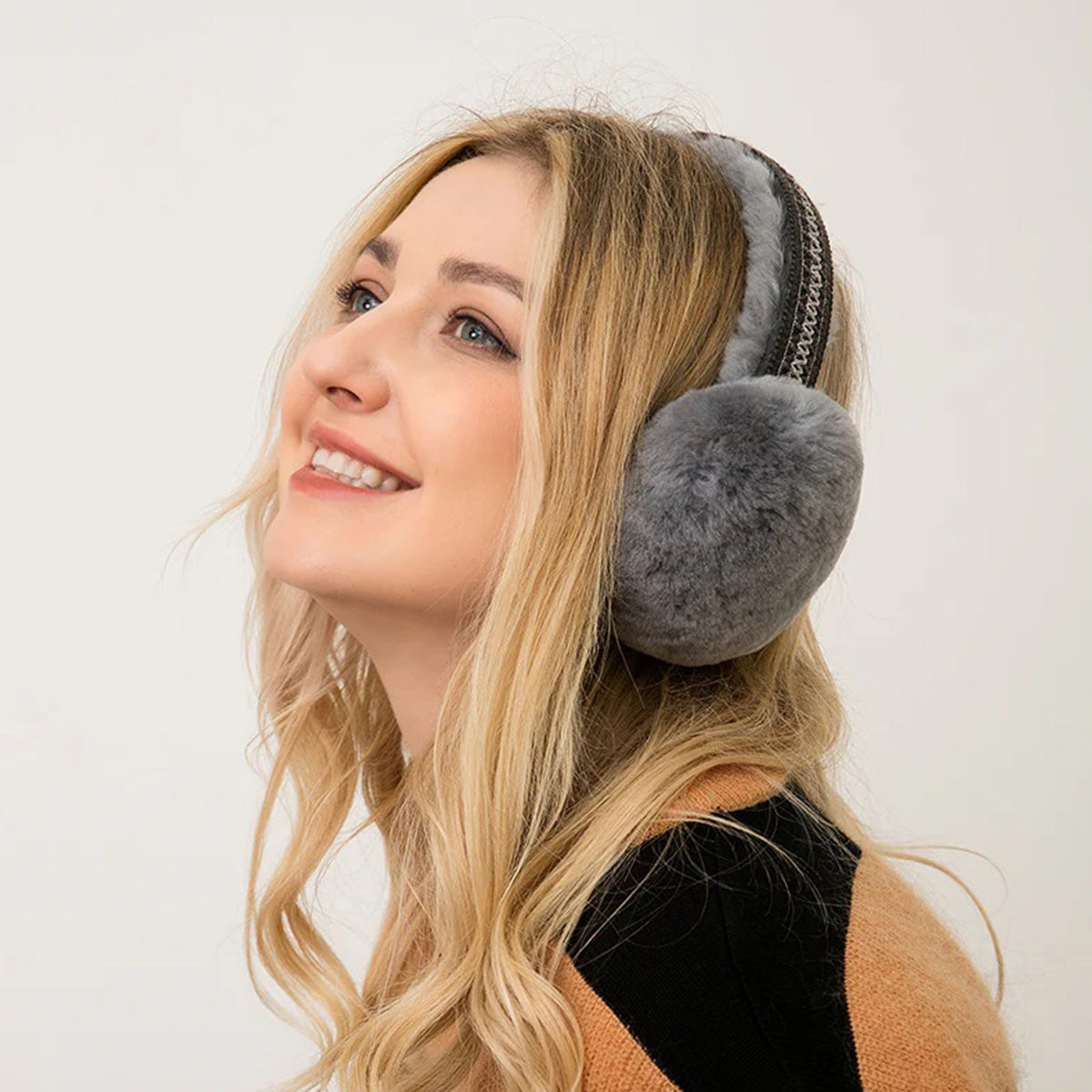 a girl wearing an UGG earmuffs