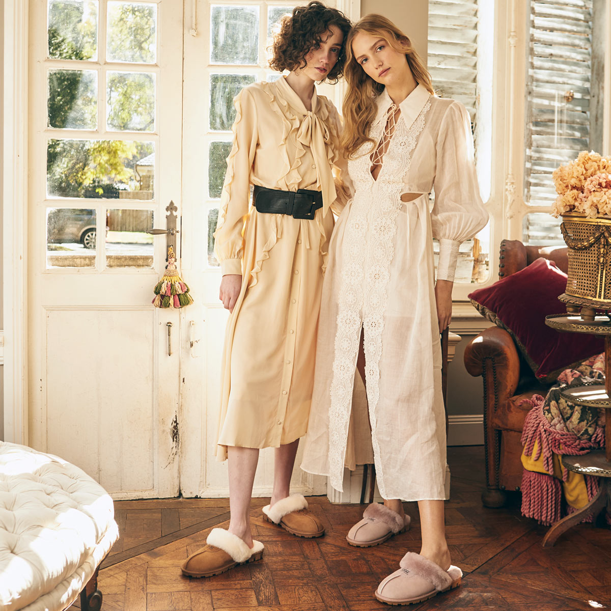 two girls wearing dress with UGG slippers